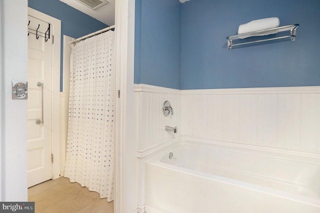 759 Avenue F, Langhorne, PA 19047 - bathroom with wainscoting, a bathtub, wood finished floors, and a shower with shower curtain