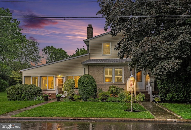 759 Avenue F, Langhorne, PA 19047 - view of front facade featuring a front yard and a chimney