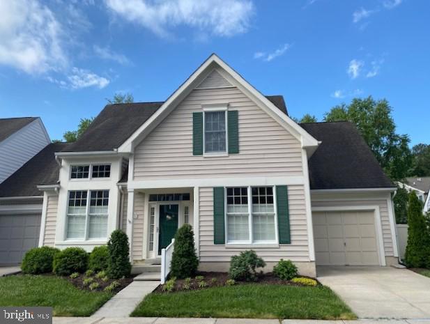 28406 Pinehurst Cir, Easton, MD 21601 - traditional-style home with an attached garage and driveway