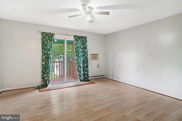 102 S Glebe Rd S, Arlington, VA 22204 - spare room with a baseboard heating unit, wood finished floors, a ceiling fan, baseboards, and a wall mounted air conditioner