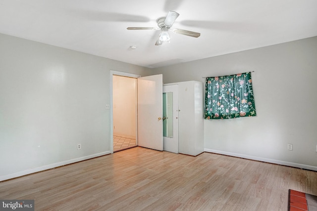 102 S Glebe Rd S, Arlington, VA 22204 - unfurnished bedroom with wood finished floors, baseboards, and a ceiling fan