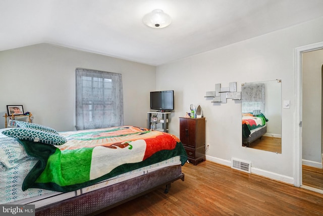 102 S Glebe Rd S, Arlington, VA 22204 - bedroom with wood finished floors, baseboards, and lofted ceiling
