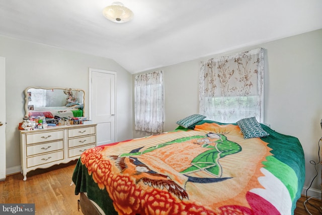 102 S Glebe Rd S, Arlington, VA 22204 - bedroom with lofted ceiling, wood finished floors, and baseboards