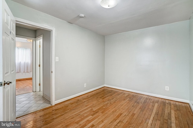 102 S Glebe Rd S, Arlington, VA 22204 - spare room featuring baseboards and light wood-style flooring