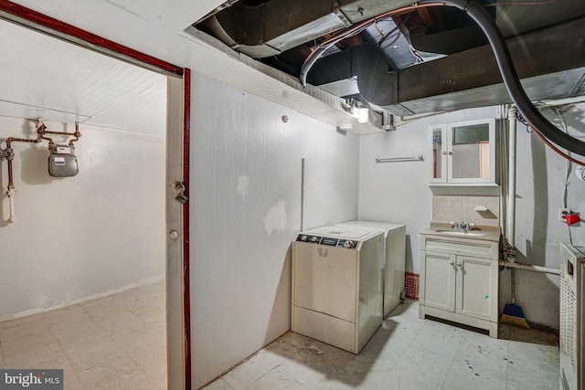 102 S Glebe Rd S, Arlington, VA 22204 - below grade area with a sink, light flooring, washer / clothes dryer, and gas meter