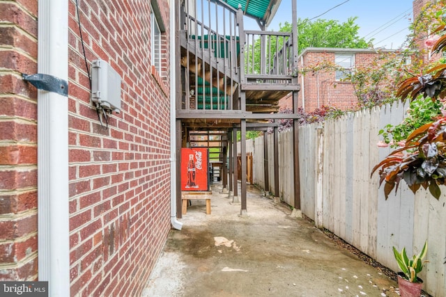 102 S Glebe Rd S, Arlington, VA 22204 - view of side of home with stairway, fence, and brick siding
