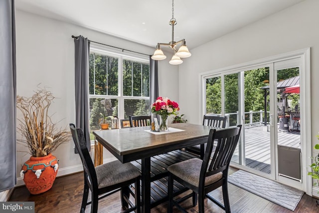 435 Potomac Run Rd, Fredericksburg, VA 22405 - dining room featuring a chandelier, wood finished floors, and baseboards