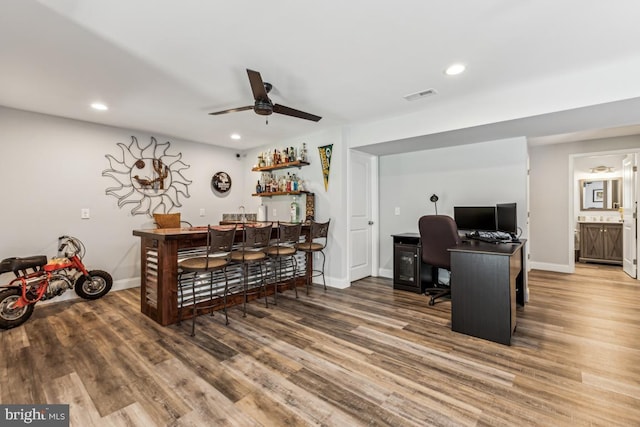 435 Potomac Run Rd, Fredericksburg, VA 22405 - home office with bar with sink, wood finished floors, recessed lighting, baseboards, and a ceiling fan