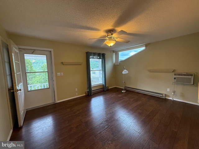 64 Mulberry St, Franklin, WV 26807 - spare room with a baseboard radiator, a ceiling fan, a textured ceiling, dark wood-style floors, and a wall mounted air conditioner