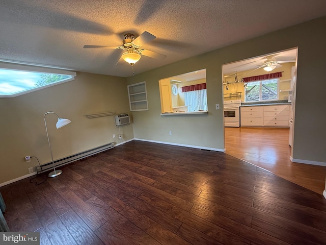 64 Mulberry St, Franklin, WV 26807 - unfurnished room featuring a baseboard heating unit, a ceiling fan, a wall mounted air conditioner, a textured ceiling, and hardwood / wood-style flooring
