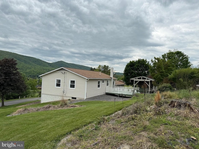 64 Mulberry St, Franklin, WV 26807 - view of side of property featuring a deck with mountain view and a yard