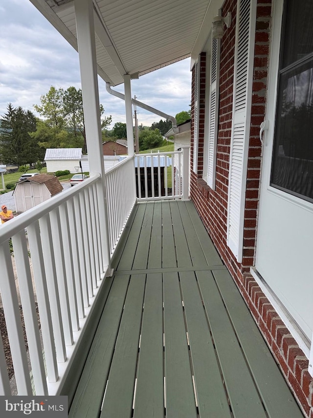 64 Mulberry St, Franklin, WV 26807 - wooden deck with a storage unit and an outbuilding