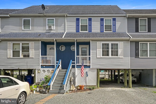 59 Wyatt St, Frederica, DE 19946 - view of property featuring a carport, cooling unit, and gravel driveway