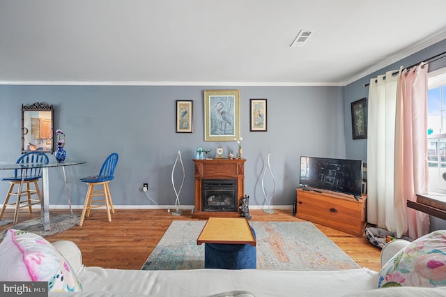 59 Wyatt St, Frederica, DE 19946 - living area with wood finished floors, crown molding, and baseboards