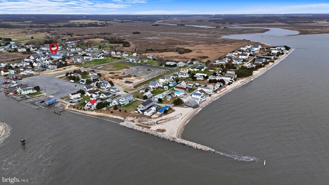 59 Wyatt St, Frederica, DE 19946 - aerial view of property and surrounding area with a large body of water and nearby suburban area