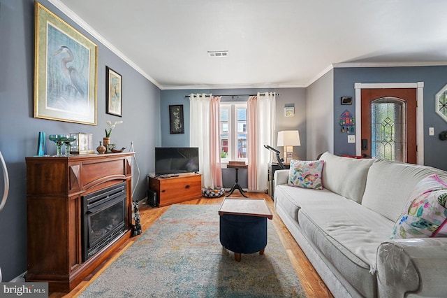 59 Wyatt St, Frederica, DE 19946 - living area featuring wood finished floors, plenty of natural light, and crown molding