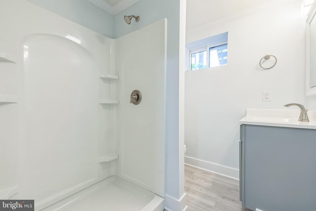 931 Oakdale Cir, Millersville, MD 21108 - full bathroom with vanity, a shower, wood finished floors, and ornamental molding