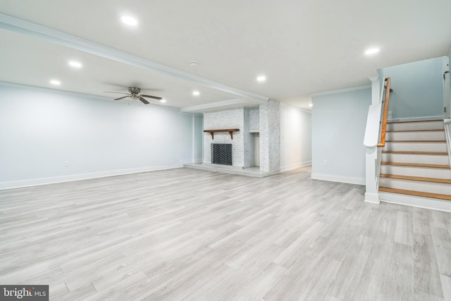 931 Oakdale Cir, Millersville, MD 21108 - unfurnished living room with recessed lighting, light wood-type flooring, stairway, a ceiling fan, and a brick fireplace