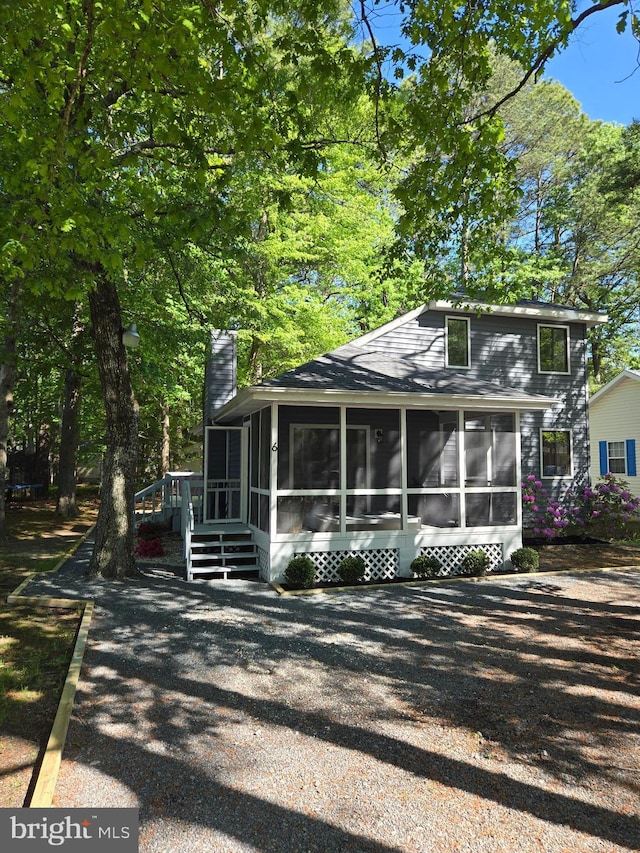 6 Granby Ln, Ocean Pines, MD 21811 - view of front facade featuring a sunroom and a chimney