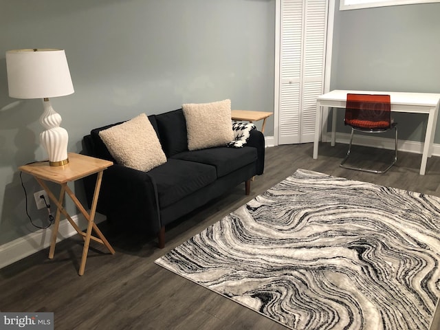 2300 Ashland Ave, Baltimore, MD 21205 - living room featuring wood finished floors and baseboards