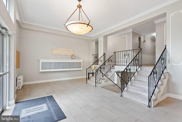 staircase with radiator, ornamental molding, and baseboards
