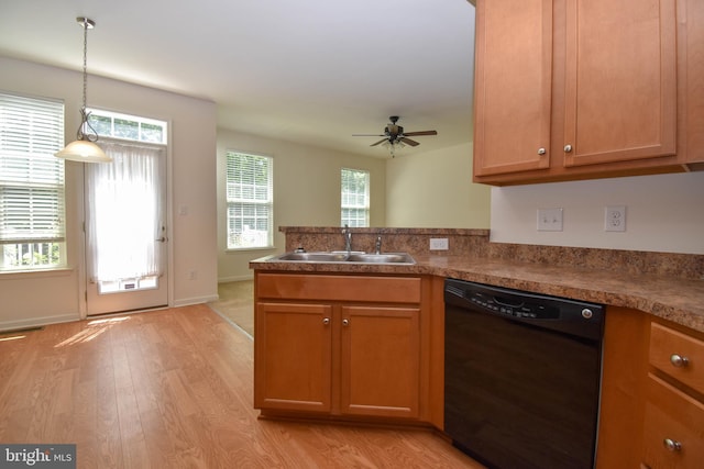 10020 Iron Pointe Dr Unit 9D, Millsboro, DE 19966 - kitchen featuring dishwasher, a sink, light wood finished floors, a peninsula, and a ceiling fan