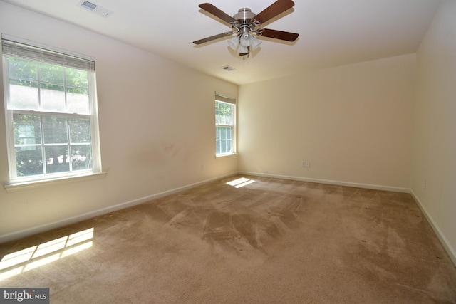 10020 Iron Pointe Dr Unit 9D, Millsboro, DE 19966 - empty room featuring healthy amount of natural light, light carpet, and baseboards