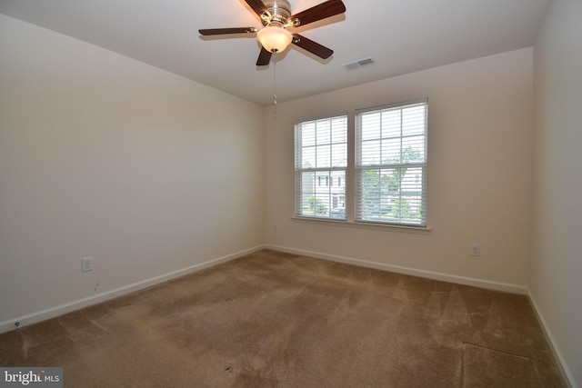 10020 Iron Pointe Dr Unit 9D, Millsboro, DE 19966 - spare room featuring carpet floors, baseboards, and a ceiling fan