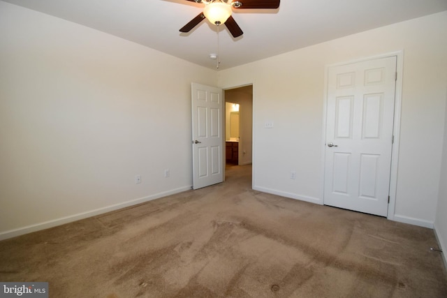 10020 Iron Pointe Dr Unit 9D, Millsboro, DE 19966 - unfurnished bedroom with carpet flooring, baseboards, and a ceiling fan