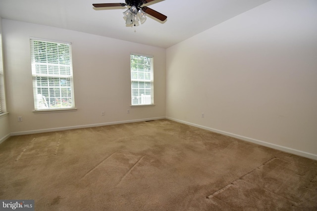 10020 Iron Pointe Dr Unit 9D, Millsboro, DE 19966 - empty room with a ceiling fan, light colored carpet, baseboards, and vaulted ceiling