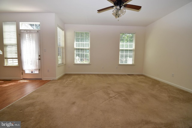 10020 Iron Pointe Dr Unit 9D, Millsboro, DE 19966 - entryway featuring carpet floors, baseboards, and a ceiling fan