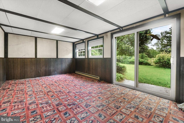 unfurnished sunroom with baseboard heating