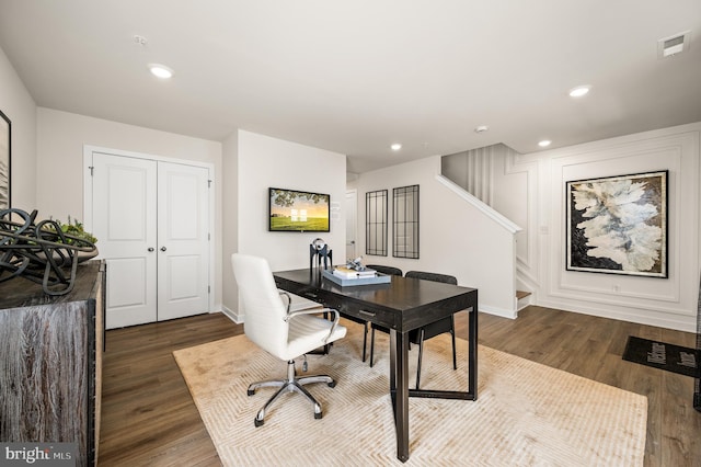 office space with dark wood finished floors, recessed lighting, and baseboards