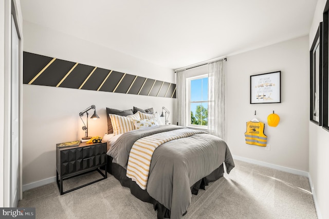 carpeted bedroom with baseboards