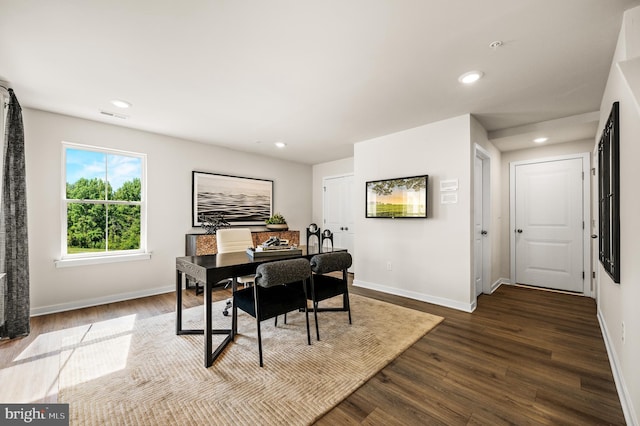 dining room featuring baseboards, dark wood-type flooring, and recessed lighting