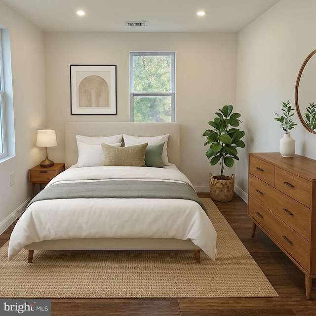 bedroom featuring dark wood-style floors, recessed lighting, and baseboards
