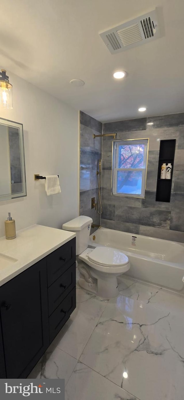 full bathroom with toilet, vanity, washtub / shower combination, recessed lighting, and marble finish floors