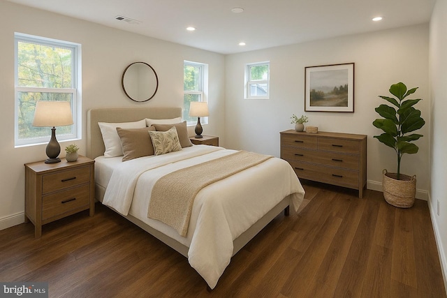 bedroom with dark wood-style flooring, recessed lighting, and baseboards