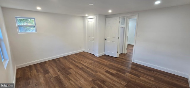 unfurnished bedroom featuring dark wood-style floors, recessed lighting, and baseboards