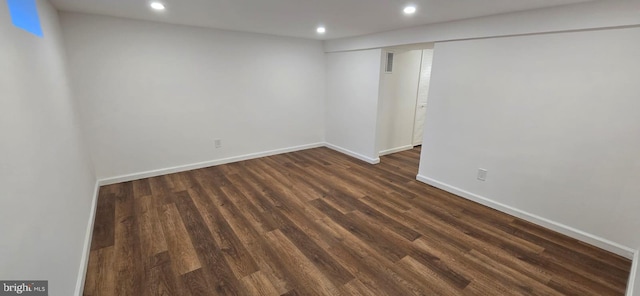 finished below grade area with recessed lighting, dark wood-style flooring, and baseboards