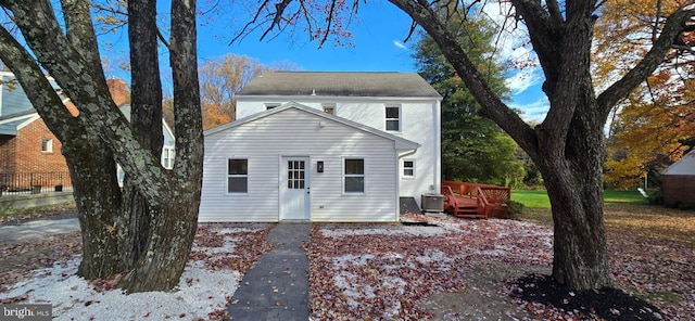 back of house with a deck and central AC