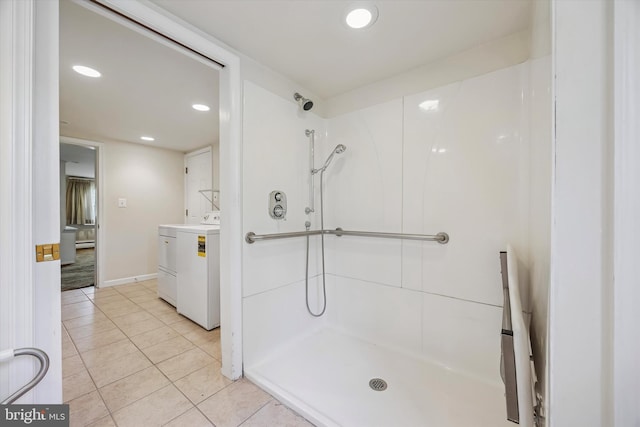 bathroom featuring washer / dryer, a shower, tile patterned floors, vanity, and recessed lighting