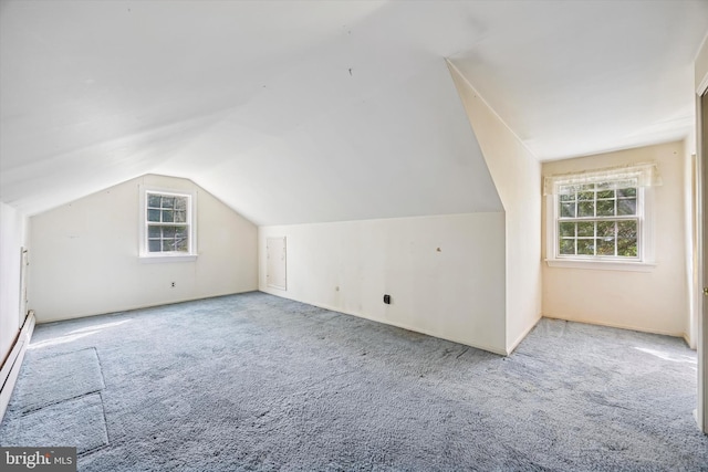 bonus room featuring carpet flooring, lofted ceiling, and a baseboard radiator