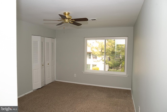unfurnished bedroom with carpet, baseboards, and a closet