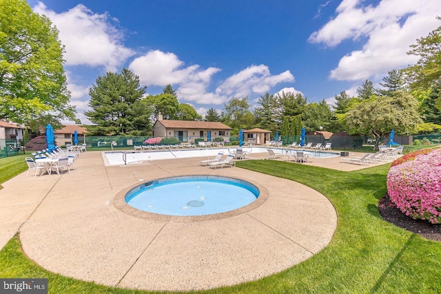 community pool featuring a patio area