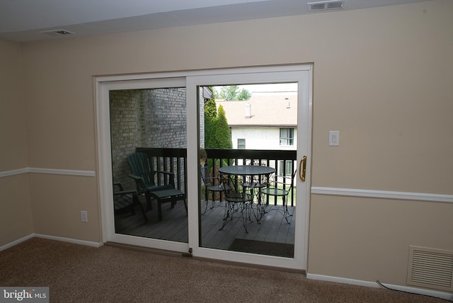 entryway with carpet flooring and baseboards