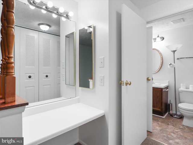 13833 Palmer House Way Unit 32-233, Silver Spring, MD 20904 - bathroom featuring vanity, toilet, and a closet