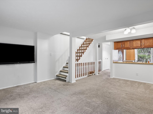 13833 Palmer House Way Unit 32-233, Silver Spring, MD 20904 - unfurnished living room featuring carpet floors, stairway, and baseboards