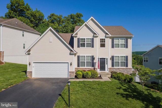 view of front facade featuring asphalt driveway, a front yard, stone siding, and a shingled roof