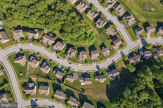 aerial view of property's location with nearby suburban area